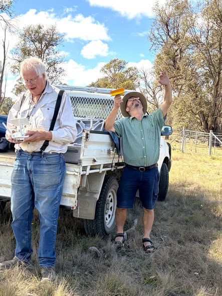 Two ADARC members setting up an antenna outdoors during the John Moyle Memorial Field Day 2026